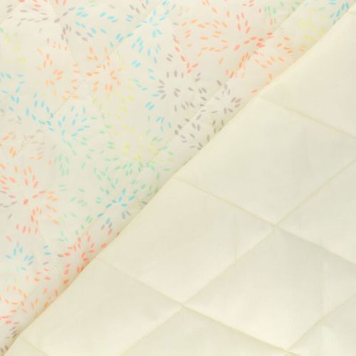 Tissu doudoune matelassé feux d'artifice fond écru Tissu doudoune matelassé feux d'artifice fond écru