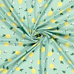 Tissu maillot de bain citrons fond vert UPF50